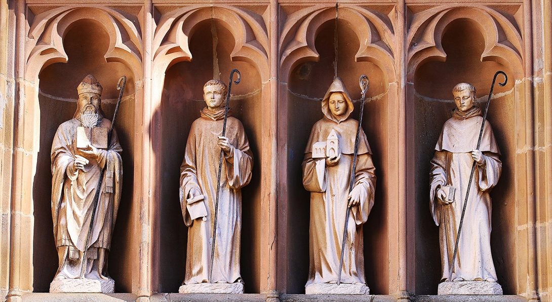 statues on the exterior of a church showing Catholic saints